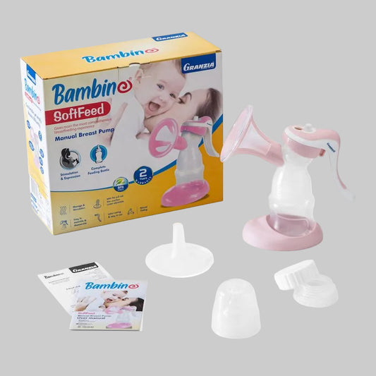 Packaging and components of a Bambini Softfeed breast pump, including the pump unit in pink and white, a breast shield, and a storage bag.